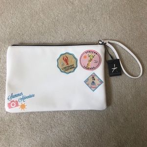 NWT Atmosphere White Clutch with Patches Wristlet